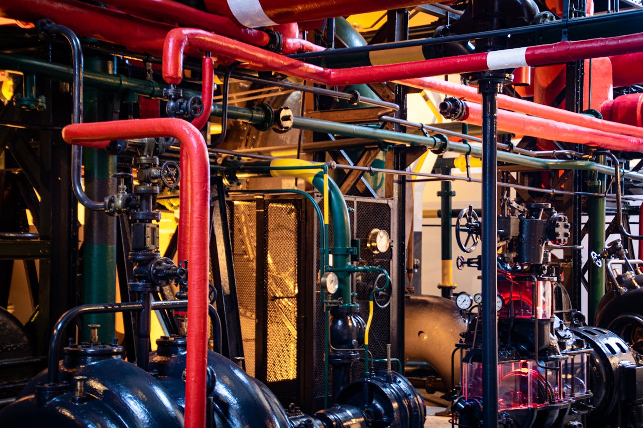 services-02 Complex network of industrial pipes and machinery inside a Lisbon plant.